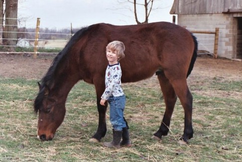 Grazing with Andrew petting.jpg (58752 bytes)